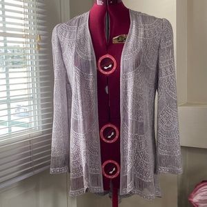 Sheer woman silver long sleeves cardigan. Size S. Used. See pictures minor flaw.